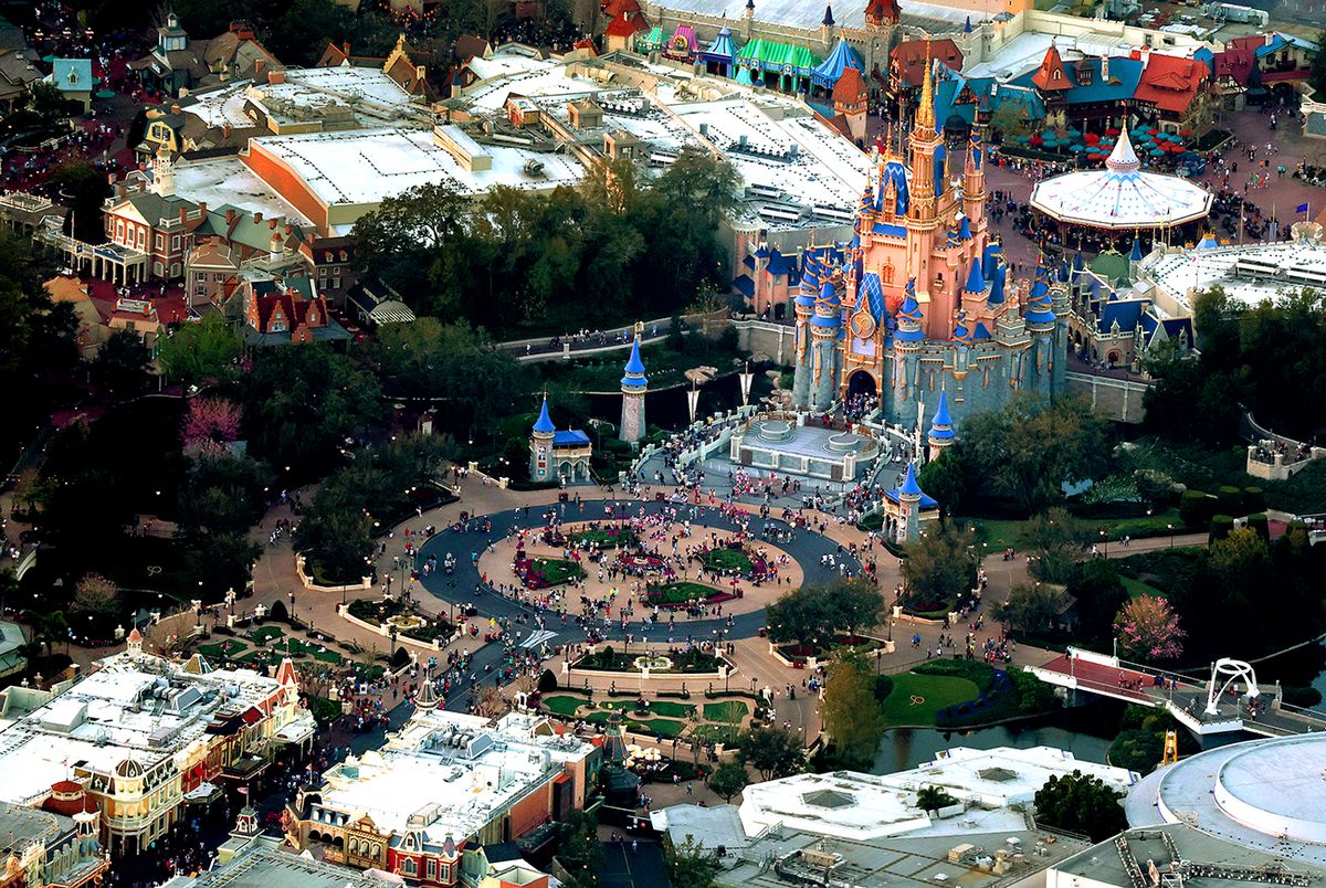Walt Disney Co Reports Quarterly Earnings Amid Ongoing Feud With Florida Gov. DeSantis
ORLANDO, FLORIDA - FEBRUARY 08: In an aerial view, Walt Disney World's iconic Cinderella Castle sits on the grounds of the theme park on February 08, 2023 in Orlando, Florida. As Florida Gov. Ron DeSantis continues his push to punish Walt Disney Co. by taking control of the board of Disney's special taxing district, the company announced today a restructuring. As a result, Disney expects to cut costs by $5.5 billion and lay off roughly 7,000 employees, or about 4 percent of its global workforce. (Photo by Joe Raedle/Getty Images)