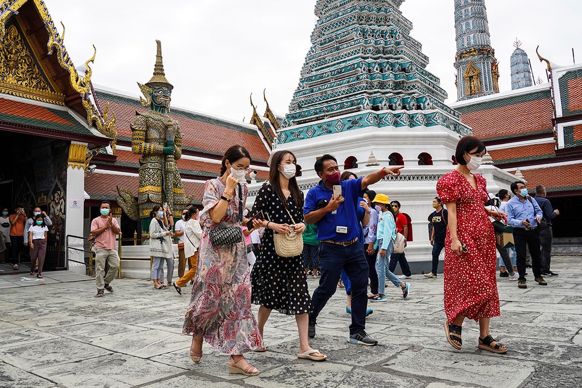 Thailand Set To Welcome Chinese Tourists To Boost The Country's Economy. Tourists visit the Emerald Buddha Temple inside the Grand Palace in Bangkok, Thailand, 08 January 2023. Thailand is expected to welcome the return of Chinese tourists without special COVID-19 health restrictions to be imposed on Chinese visitors, aimed to boost the country's economy and recover the tourism industry after China's government easing travel restrictions. (Photo by Anusak Laowilas/NurPhoto via Getty Images)