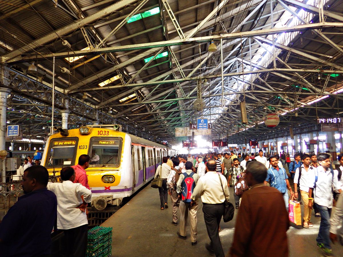 MUMBAI, INDIA - January, 2014: People on the platform during rush hour at railway station Chhatrapati Shivaji Terminus in Mumbai, India.