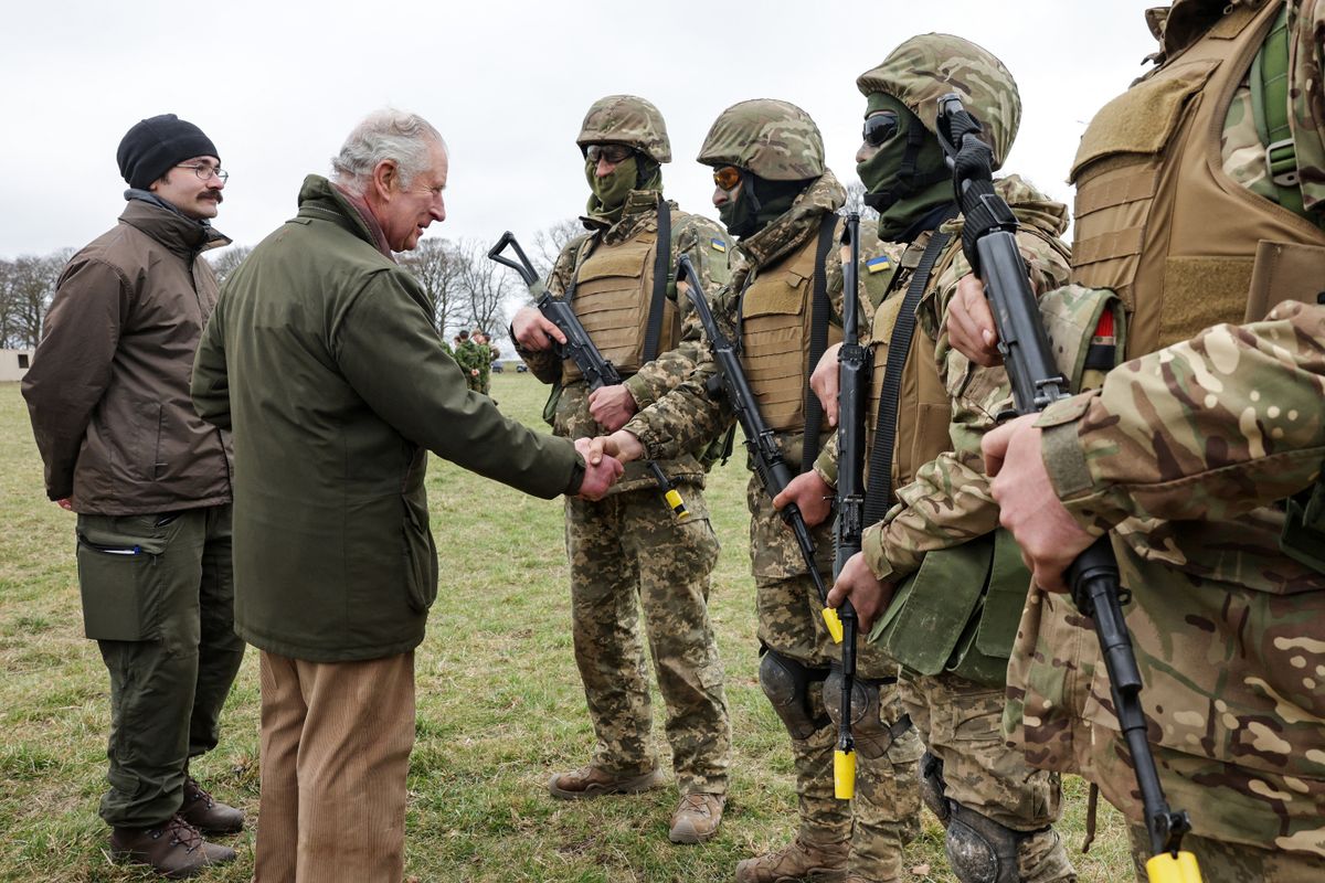 Britain's King Charles III (2L) meets with Ukrainian recruits being trained by British and international partner forces at a site in Wiltshire in south-west England on February 20, 2023. - The recruits are completing five weeks of basic combat training by British and international partner forces, before returning to fight in Ukraine. 