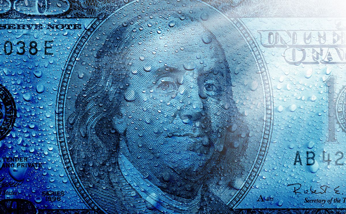 financial concept of money close up shot of one hundred dollar bill and water drops