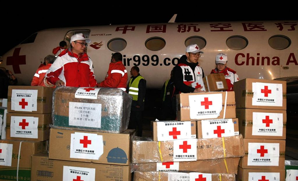 A handout picture released by the official Syrian Arab News Agency (SANA) on February 9, 2023, shows the unloading of a Chinese plane carrying aid for the victims of the earthquake that hit Turkey and Syria, in the capital Damascus. (Photo by SANA / AFP) / == RESTRICTED TO EDITORIAL USE - MANDATORY CREDIT "AFP PHOTO / HO / SANA" - NO MARKETING NO ADVERTISING CAMPAIGNS - DISTRIBUTED AS A SERVICE TO CLIENTS ==