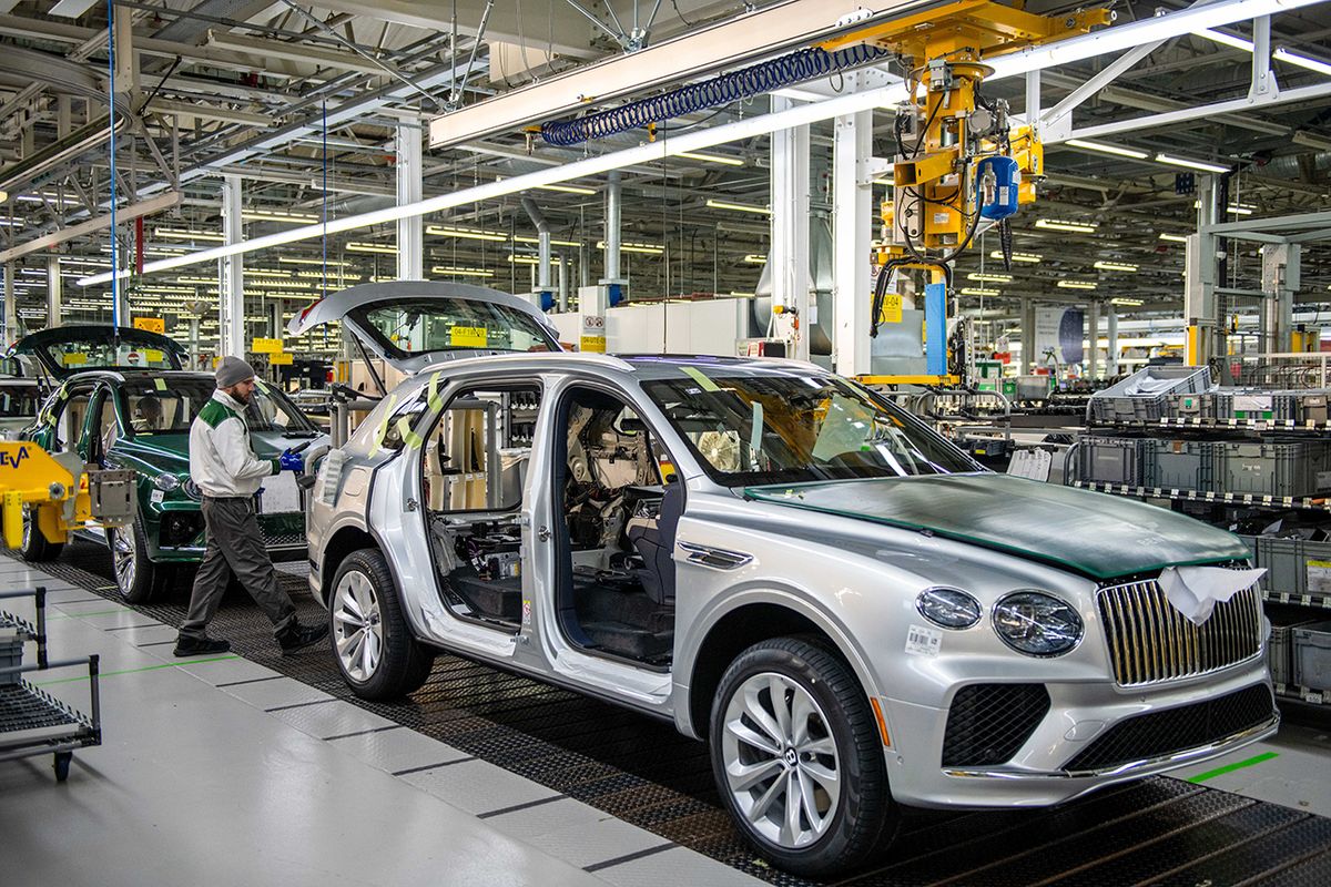 Inside The Bentley Motors Ltd. UK Plant
A Bentley Bentayga sport utility vehicle on the production line at the Bentley Motors Ltd. headquarters in Crewe, UK, on Wednesday, Dec. 7, 2022. Bentley plans to offer only plug-in hybrid and electric cars by 2026 and switch its entire lineup to fully battery-powered vehicles by the end of the decade. Photographer: Chris J. Ratcliffe/Bloomberg via Getty Images