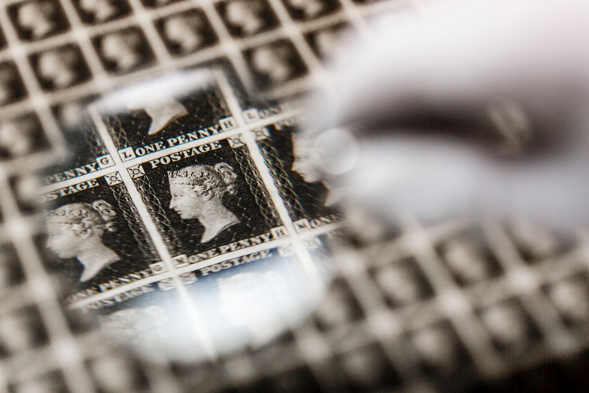 Priceless Sheet Of World's First Stamps, The Penny Black, Leaves UK For First Time
LONDON, ENGLAND - MAY 25:  A priceless sheet of Penny Blacks - the world's first ever postage stamp - is inspected prior to heading abroad for the first time in a specially designed, bomb-proof briefcase at The Postal Museum on May 25, 2016 in London, England. A priceless sheet of the world's first stamps, the Penny Black, is set to leave the UK for the first time today. The sheet is one of only a handful left in the world, all of which are housed at The Postal Museum in London.  The 176 year-old stamps - normally stored in a secure humidity controlled, alarmed vault - are so rare that they are being transported under armed escort in a specially designed bomb-proof briefcase.  The briefcase has also been fitted with sensors and shock alarms to allow the Museum to check on the condition of the stamps throughout their journey.  Once landed, they will be put on display at the World Stamp Show in New York, which happens just once every 10 years and is expected to welcome a quarter of a million visitors. After the show, the sheet of Penny Blacks will go on permanent public display for the first time when The Postal Museum opens its doors in spring 2017.  (Photo by Miles Willis/Getty Images for The Postal Museum)