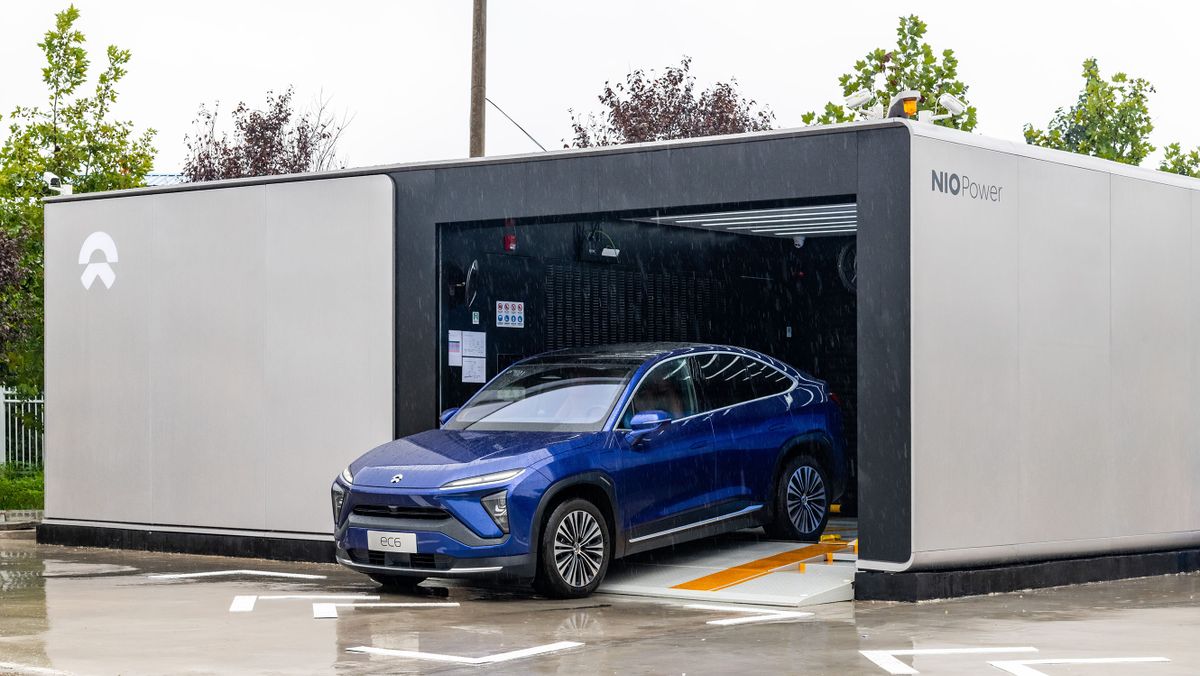 XI AN, CHINA - SEPTEMBER 18: A Nio Inc. EC6 electric sport utility vehicle (SUV) is seen at a NIO battery swap station on September 18, 2021 in Xi an, Shaanxi Province of China.