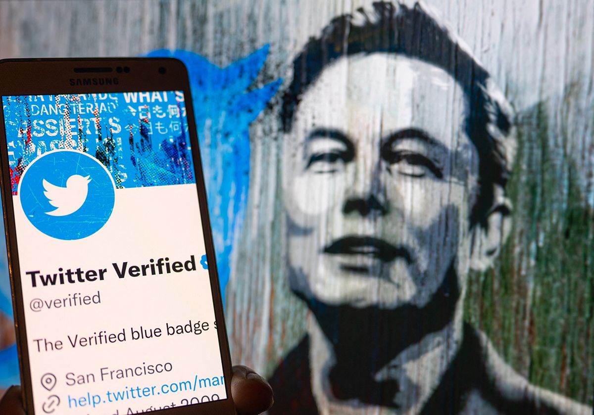 Twitter Verified Icon Illustration
Twitter Verified icon seen on mobile screen with Elon Musk in the background illustration, in Brussels, Belgium, on December 11, 2022 (Photo illustration by Jonathan Raa/NurPhoto) (Photo by Jonathan Raa / NurPhoto / NurPhoto via AFP)