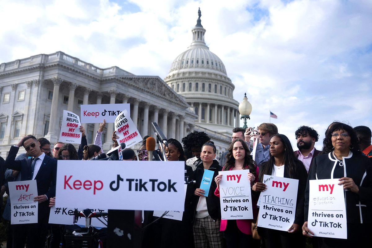 People gather for a press conference about their opposition to a TikTok ban on Capitol Hill in Washington, DC on March 22, 2023. - The White House was reported on March 15, 2023, to have told the app TikTok that it will be banned in the US if it continues to be owned by the Beijing-based tech firm Bytedance. (Photo by Brendan Smialowski / AFP)