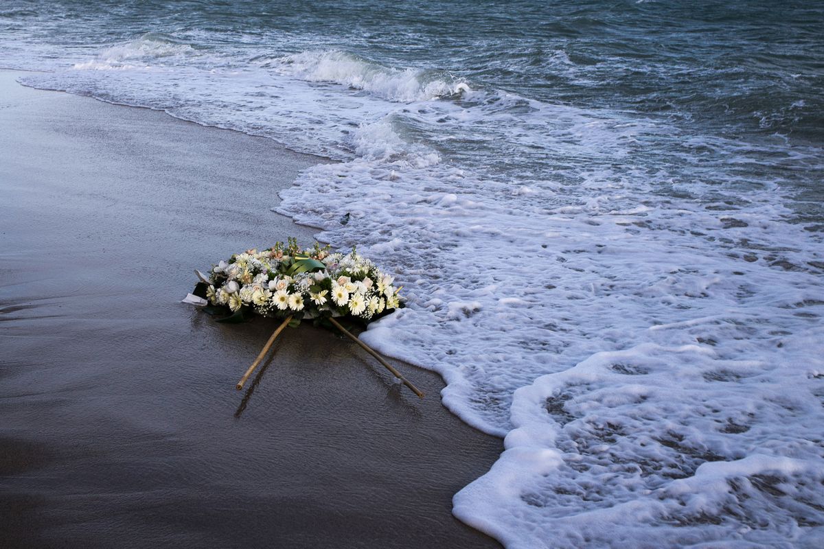 A wreath of flowers floats on the Mediterranean Sea, thrown by people who ended a protest march on the beach at the site of the shipwreck on March 11, 2023 in Steccato di Cutro, Calabria region, southern Italy, as part of the movement 'Stop the massacre, now!' (Fermare la strage, subito!) launched by the 'National Network February 26' created following the February 26, 2023 shipwreck that killed at least 74 migrants, including children, in Steccato di Cutro. - The February 26 shipwreck, which death toll reached 74 people after the body of a girl of 4 or 5 years old washed up on the beach, has drawn sharp criticism of the right-wing government led by Prime Minister Giorgia Meloni for its failure to intervene timely to save the boat. 