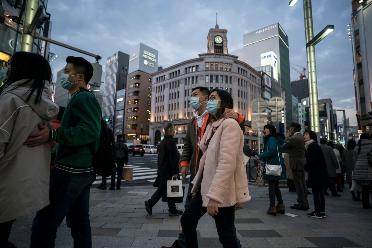 TOKYO, JAPAN - JANUARY 24: Chinese tourists wearing masks walk through the Ginza shopping district on January 24, 2020 in Tokyo, Japan. While Japan is one of the most popular foreign travel destinations for Chinese tourists during the Lunar New Year holiday this year, Japan reported two cases of Wuhan coronavirus infections as the number of those who have died from the virus in China climbed to 25 on Friday and cases have been reported in other countries including the United States, Thailand, Taiwan, Vietnam, Singapore and South Korea. 