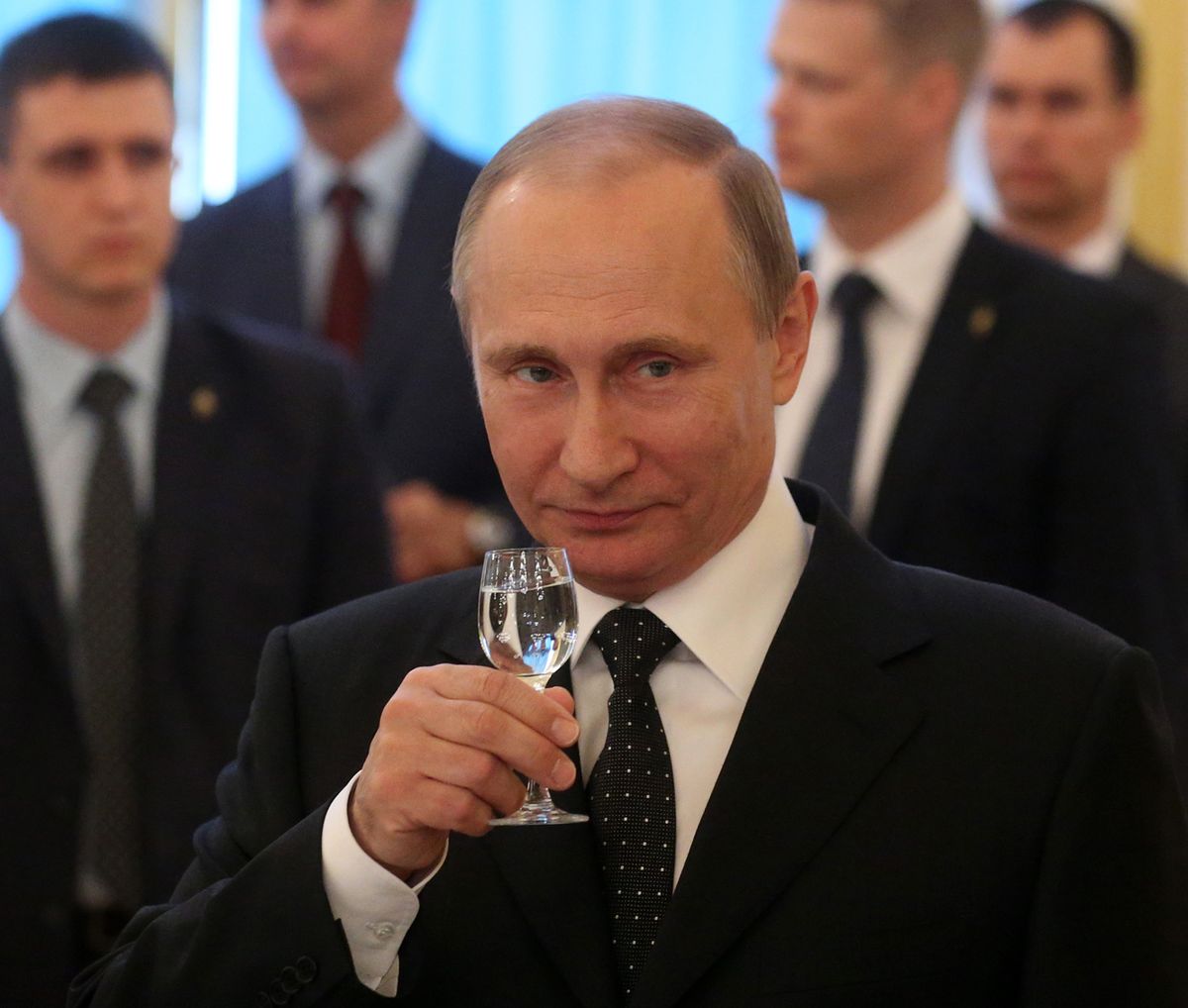 MOSCOW, RUSSIA - JUNE 28: (RUSSIA OUT) Russian President Vladimir Putin toasts holding a glass of vodka during the reception for graduates of military academies and universtities at the Grand Kremlin Palace on June 28, 2016 in Moscow, Russia. 