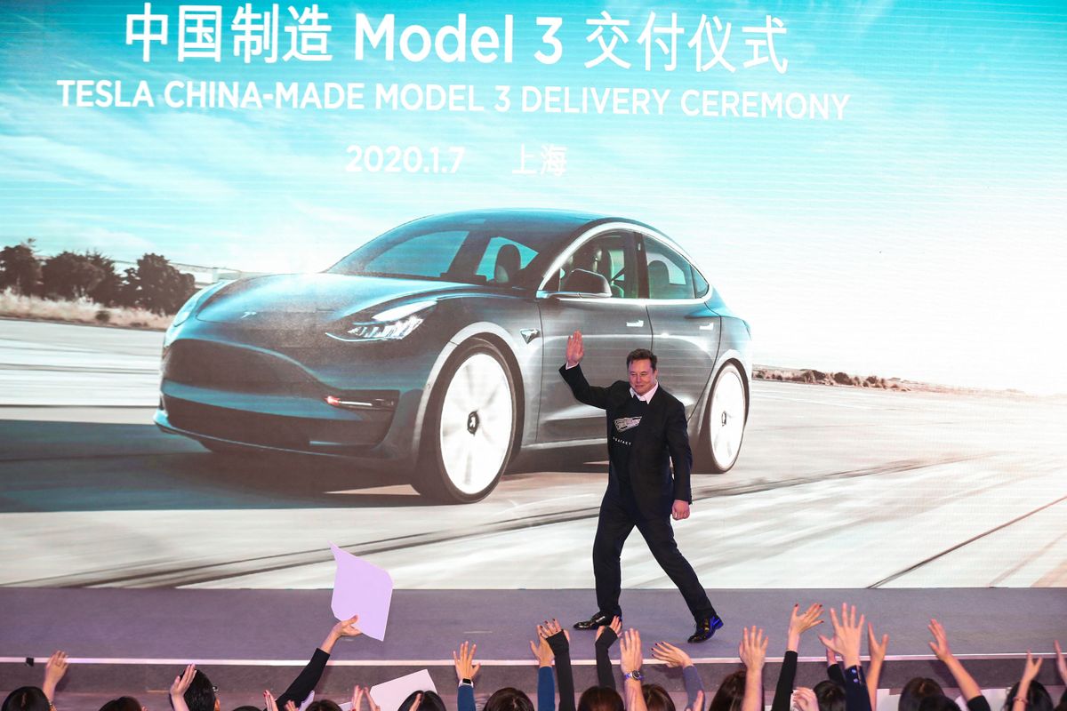 Tesla CEO Elon Musk gestures during the Tesla China-made Model 3 Delivery Ceremony in Shanghai. - Tesla CEO Elon Musk presented the first batch of made-in-China cars to ordinary buyers on January 7, 2020 in a milestone for the company's new Shanghai "giga-factory", but which comes as sales decelerate in the world's largest electric-vehicle market. 
