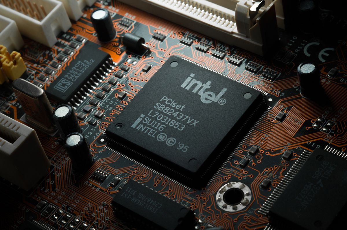 Russia,,Berdsk,-,17,Feb,2021:,Intel,Computing,Chip,On
Russia, Berdsk - 17 feb 2021: Intel computing chip on an old motherboard. Old electronics close-up. Chip ICS. Electronic background. Selective focus