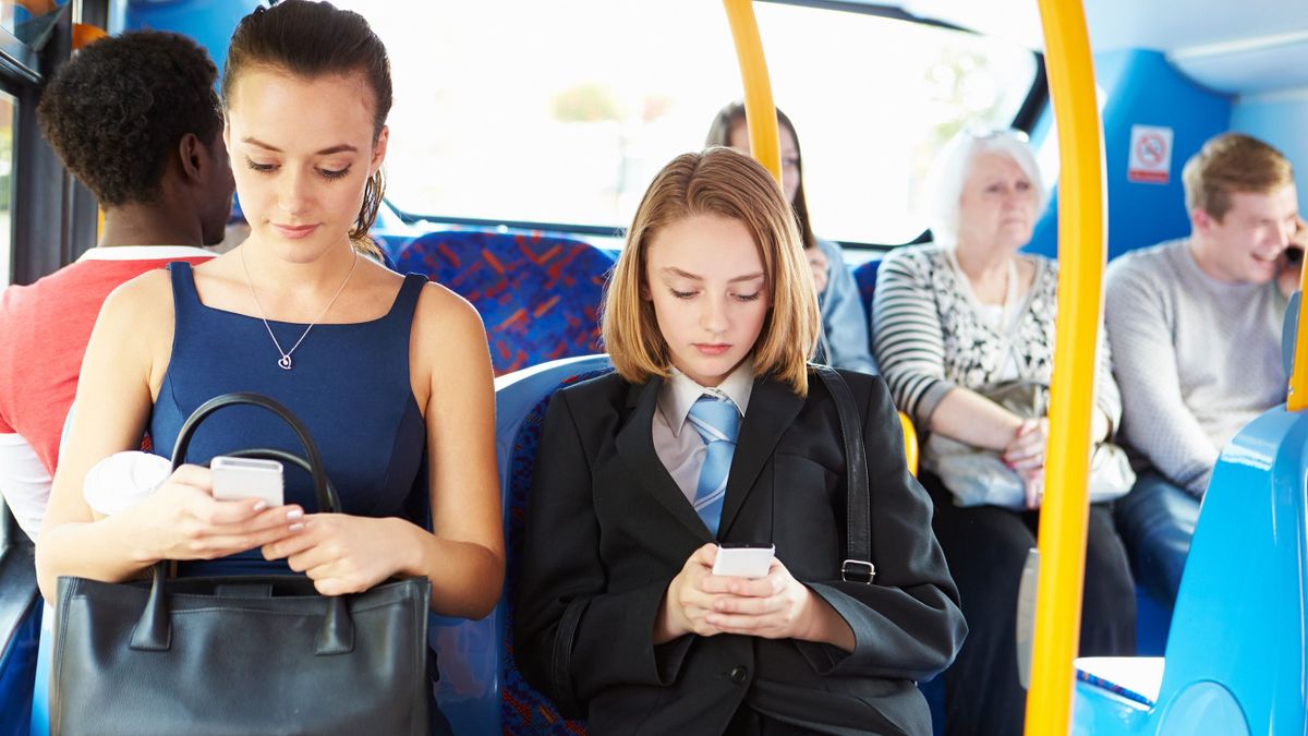 Passengers,Sitting,On,Bus,Sending,Text,Messages