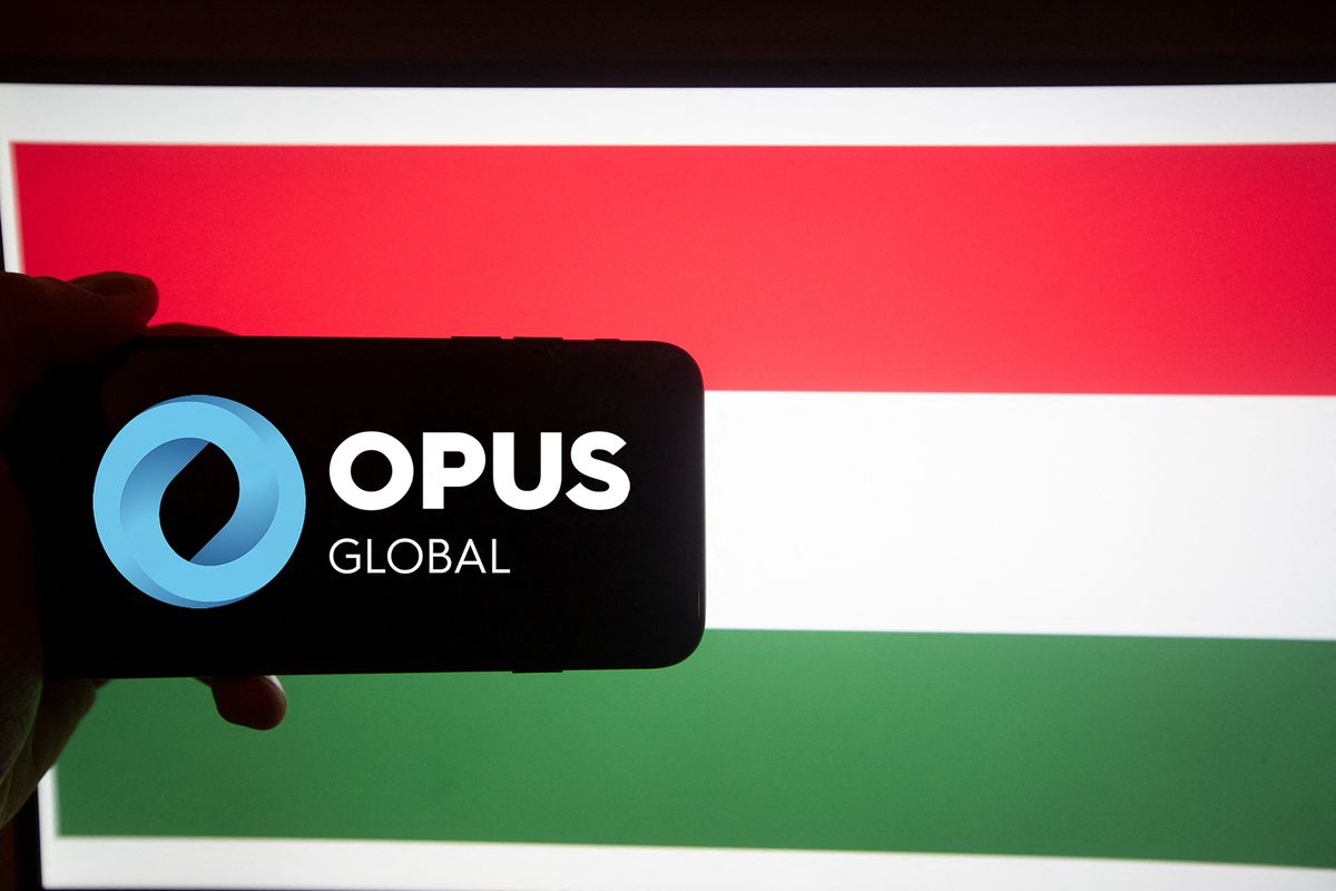 Hungarian BUX Companies
The logo of Opus is seen on a screen of a smartphone in front of a hungarian flag. It is part of the BUX, the major index of Hungary. Opus primarily works on management and trusteeship of companies with different profiles as a financial investor in holding structure. (Photo by Alexander Pohl/NurPhoto) (Photo by Alexander Pohl / NurPhoto / NurPhoto via AFP)