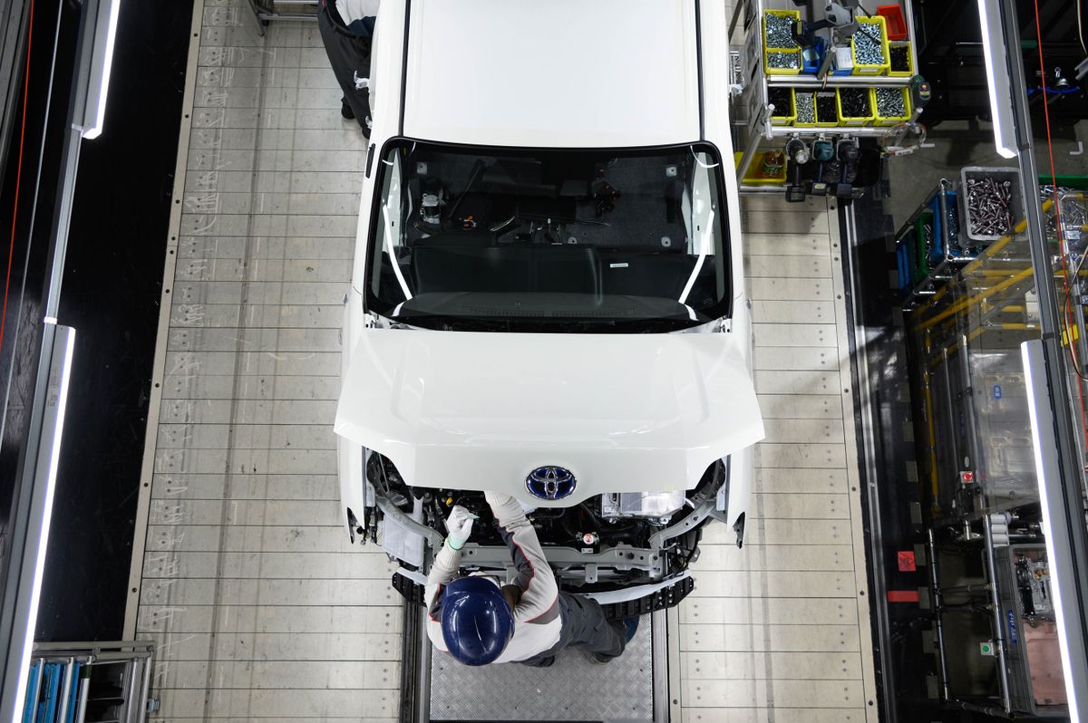 A worker assembles a Toyota Motor Corp. Provox vehicle on the production line at the Daihatsu Motor Co. Kyoto plant in Oyamazaki, Kyoto Prefecture, Japan, on Friday, Oct. 7, 2022. Daihatsu, wholly-owned subsidiary of Toyota Motor Corp., opened the renovated Kyoto plant to the members of media on Friday. Photographer
