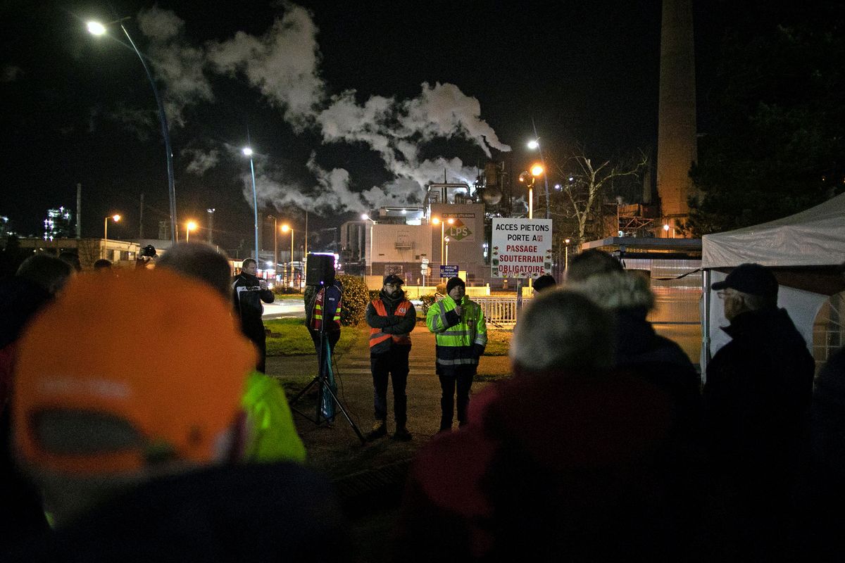 Unionists take part in a strike vote at the Exxon-Mobil Port Jerome Gravenchon refinery, in Port-Jerome-sur-Seine, near Le Havre, northwestern France, on March 7, 2023, on the sixth day of nationwide rallies organized since the start of the year against French President's pension reform and its postponement of the legal retirement age from 62 to 64. - France's trade unions were headed for a crucial face-off with President Emmanuel Macron on March 7, 2023, with fresh strikes and protests planned against a controversial pensions reform he has championed. 