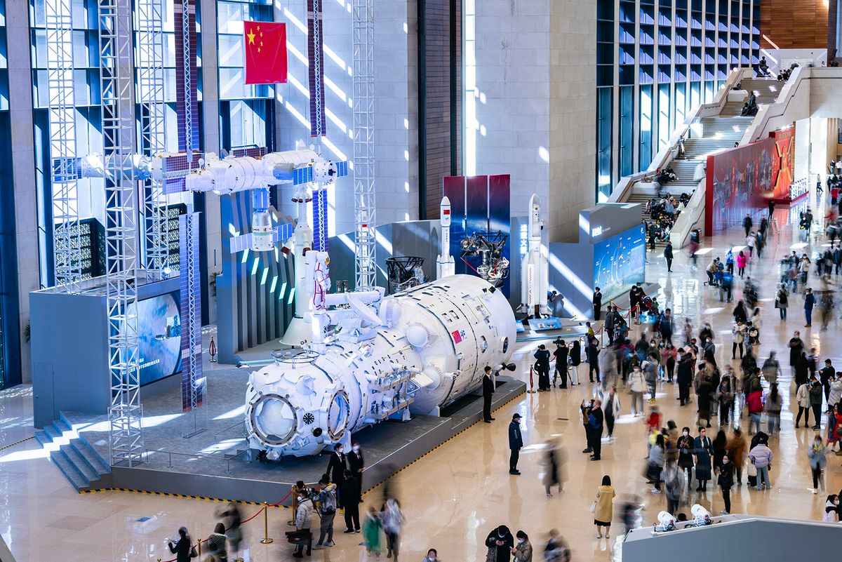 Exhibition Showcasing China's Manned Space Achievements Kicks Off In Beijing BEIJING, CHINA - FEBRUARY 24: Visitors look at a life-size model of 'Tianhe', the core module of China's first space station, during the Exhibition of Achievements in China's Manned Spaceflight Program of 30 Years at the National Museum of China on February 24, 2023 in Beijing, China. (Photo by Hou Yu/China News Service/VCG via Getty Images)