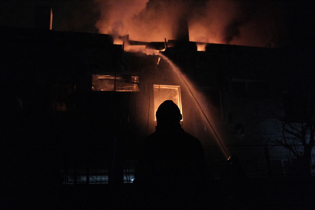 Firefighters extinguish a fire in a building materials store after a Russian drone attack in the Ukrainian capital, Kiev, on March 28, 2023. 
