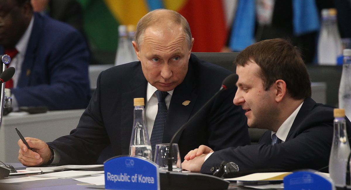 Argentina G20 Leaders' Summit 2018 - Day 1 Of Sessions BUENOS AIRES, ARGENTINA - NOVEMBER 30: (RUSSIA OUT) Russian President Vladimir Putin (L) listens to Economy Development Minister Maxim Oreshkin (R) during the G20 Summit's Plenary Meeting on November 30, 2018 in Buenos Aires, Argentina. U.S. President Donald Trump cancelled his meeting with Russian President Vladimir Putin at the G20 Summit that was planned for Saturday. (Photo by Mikhail Svetlov/Getty Images)