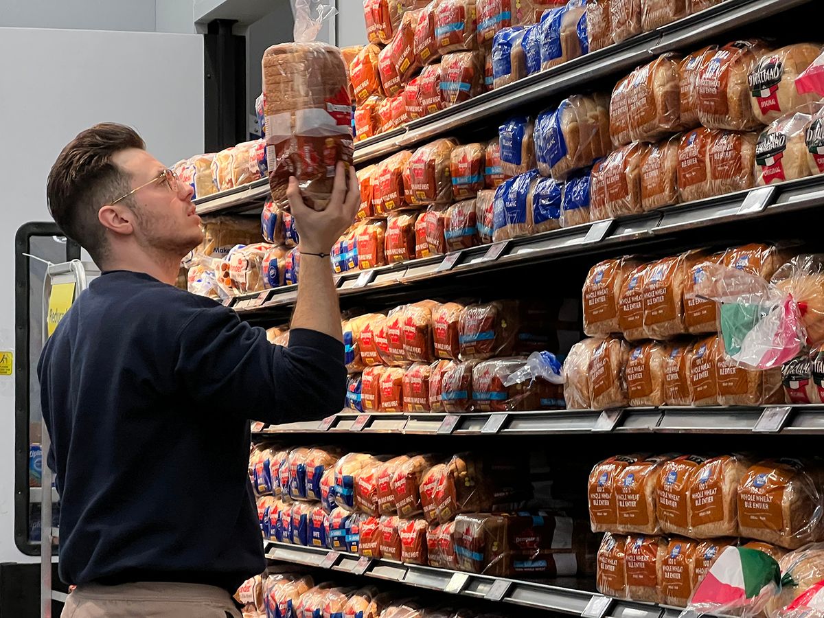 Inflation And High Grocery Prices Continue To Plague Canadians Man reads the ingredients on the package of a loaf of bread at a grocery store in Toronto, Ontario, Canada on March 11, 2023. Inflation and high grocery prices continue to plague Canadians. (Photo by Creative Touch Imaging Ltd./NurPhoto via Getty Images)