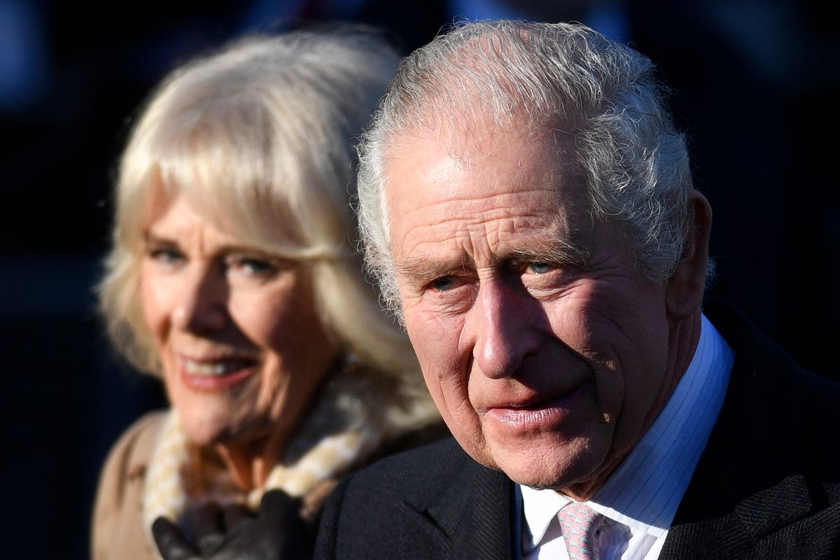 (FILES) In this file photo taken on January 20, 2023 Britain's King Charles III and Britain's Camilla, Queen Consort leave after visiting Bolton Town Hall in Bolton, north west England. - Charles III arrives in France on Sunday, March 26, for his first state visit as king, but the planned celebrations of historic cross-Channel relations face potential disruption from protests over unpopular pension reforms. 