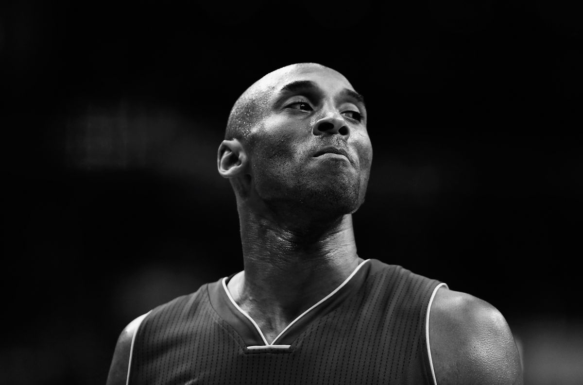 WASHINGTON, DC - DECEMBER 02: (Editors Note: Image has been converted to black and white) Kobe Bryant #24 of the Los Angeles Lakers looks on against the Washington Wizards in the first half at Verizon Center on December 2, 2015 in Washington, DC.  NOTE TO USER: User expressly acknowledges and agrees that, by downloading and or using this photograph, User is consenting to the terms and conditions of the Getty Images License Agreement. 