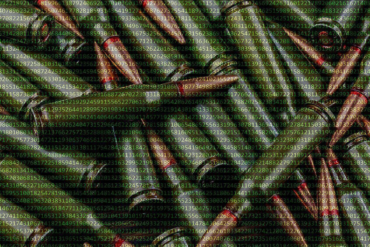 Rifle cartridges on the background of a digital code. Attack of hackers on state structures