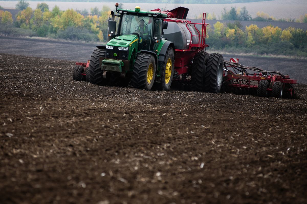 A tractor pulls a seed drill during the sowing of the winter wheat crop at a farm in Flora village, Odesa Oblast, Ukraine, on Wednesday, Sept. 28, 2022. There are persistent concerns over the fate of the Black Sea export deal that's allowed vessels carrying Ukrainian crops to make their way onto the world market. 