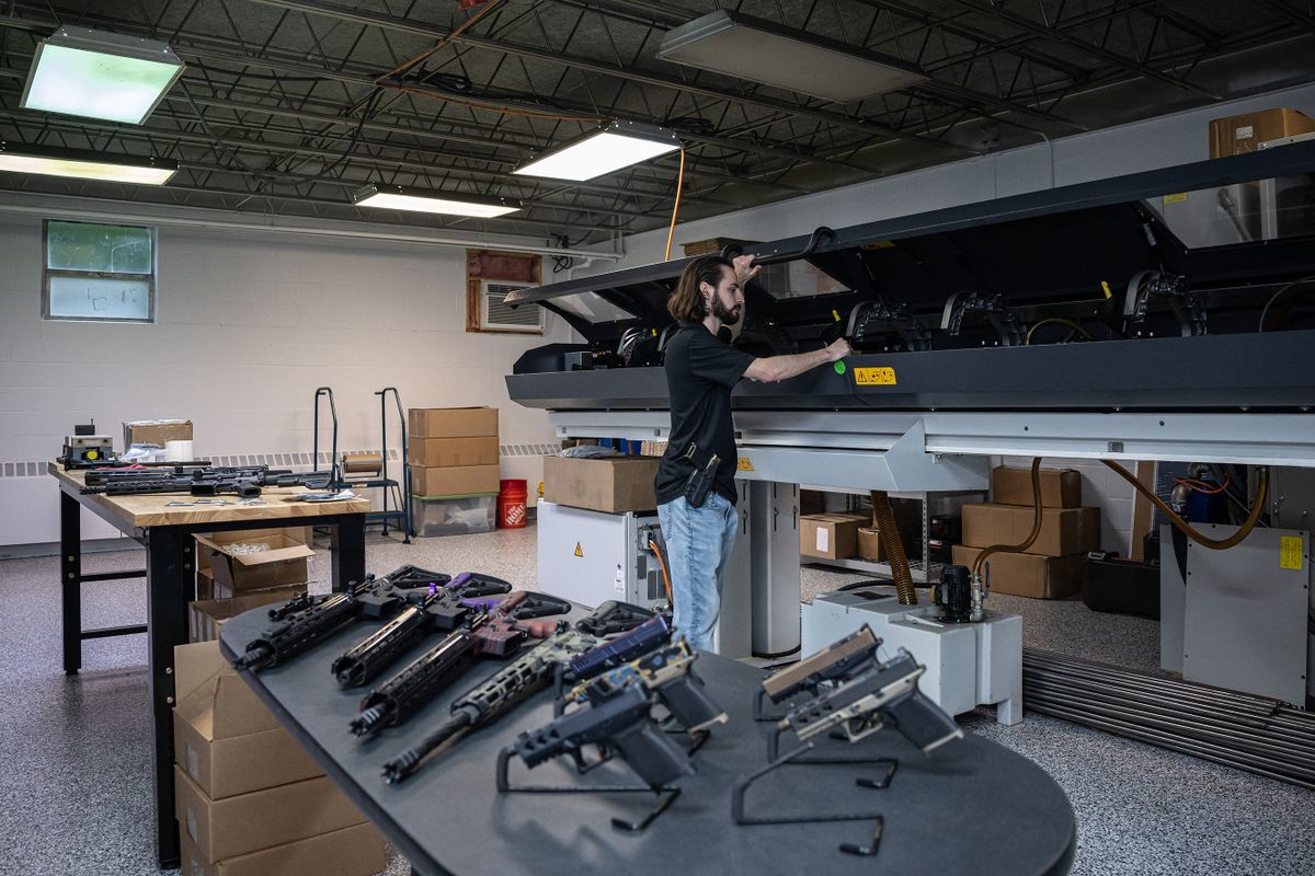 Matrix Arms owner and gun manufacturer Allen Farris checks equipment on a production line at his factory in Claremont, New Hampshire on June 3, 2022.. - Smaller gun makers are booming in the US , thanks to ravenous and sometimes specialized demand for pricey limited-production pistols and custom rifles, engraved with bible passages or the US flag. The millions of guns produced annually in the US are primarily made by the nation's biggest manufacturers, yet smaller operators have poured into a market that saw production nearly triple from 2000 to 2020.