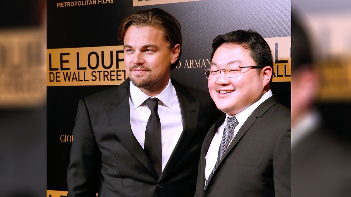 'The Wolf of Wall Street' : Photocall At Cinema Gaumont Opera Capucines
PARIS, FRANCE - DECEMBER 09:  Actor Leonardo DiCaprio with Jho Low  (right) of the movie attend the photocall before the 'The Wolf of Wall Street' World movie Premiere at Cinema Gaumont Opera on December 9, 2013 in Paris, France.  (Photo by Bertrand Rindoff Petroff/Getty Images)