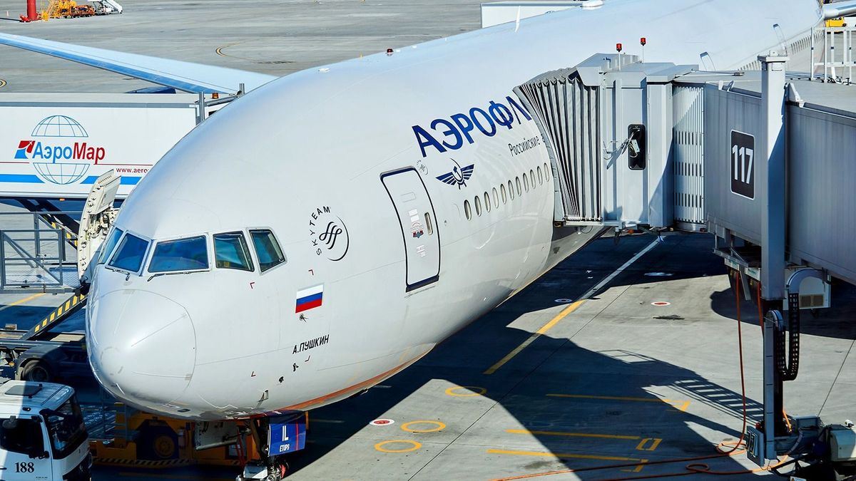 Moscow,,Russia,-,September,16,,2020:,Boarding,Passengers,On,A,
Moscow, Russia - September 16, 2020: boarding passengers on a plane using a jet bridge and loading baggage at Sheremetyevo airport