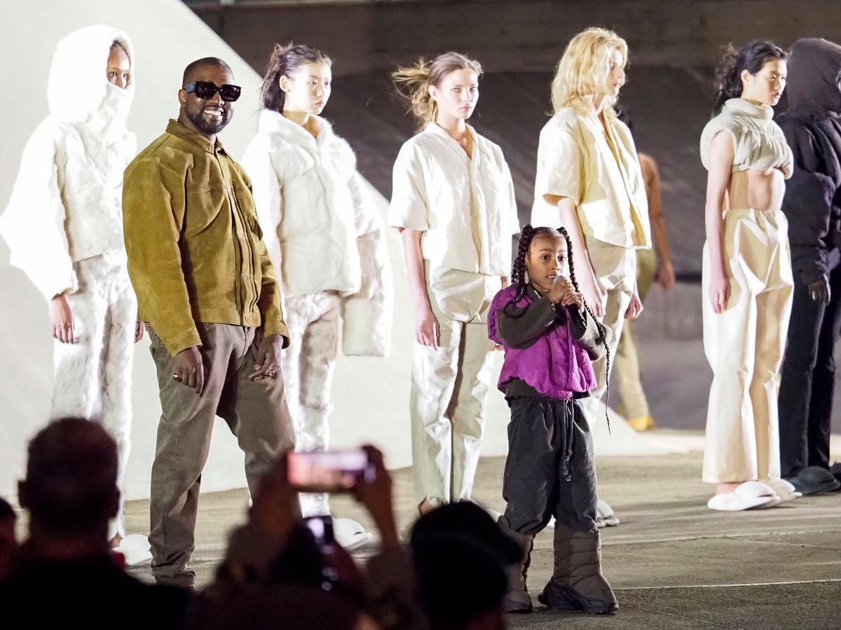 PARIS, FRANCE - MARCH 02: Kanye West and daughter North West on the runway of the Yeezy fashion show during Paris Fashion Week Womenswear Fall/Winter 2020/2021 on March 02, 2020 in Paris, France. 