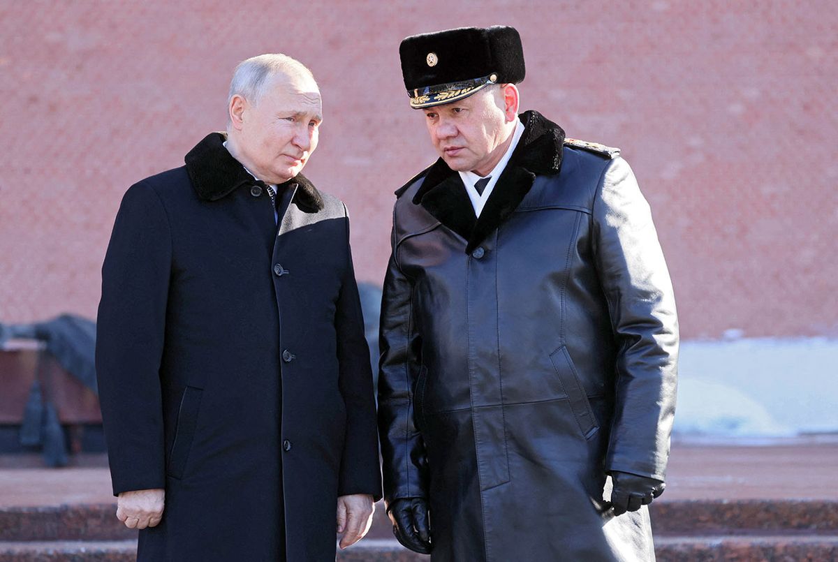 Russian President Vladimir Putin (L) and Russian Defence Minister Sergei Shoigu attend a wreath-laying ceremony at the Eternal Flame and the Unknown Soldier's Grave in the Alexander Garden during an event marking Defender of the Fatherland Day in Moscow on February 23, 2023. (Photo by Mikhail Metzel and Mikhail METZEL / Sputnik / AFP)
