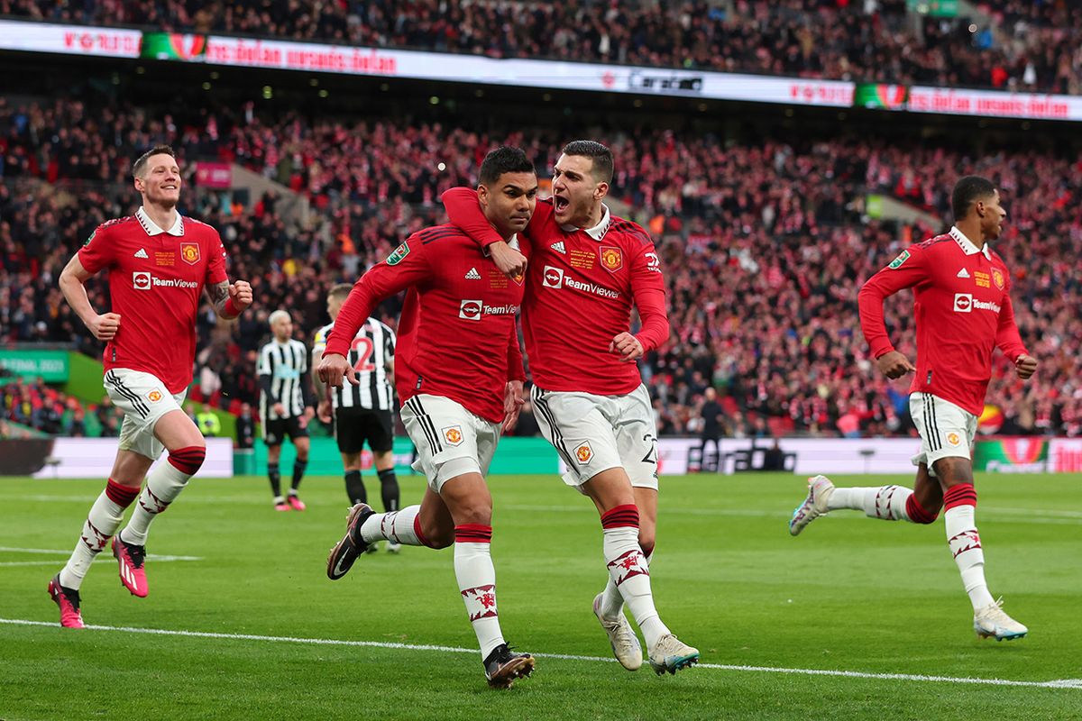 Manchester United v Newcastle United - Carabao Cup Final
LONDON, ENGLAND - FEBRUARY 26: Casemiro of Manchester United celebrates scoring the opening goal with Diogo Dalot during the Carabao Cup Final match between Manchester United and Newcastle United at Wembley Stadium on February 26, 2023 in London, England. (Photo by Marc Atkins/Getty Images)