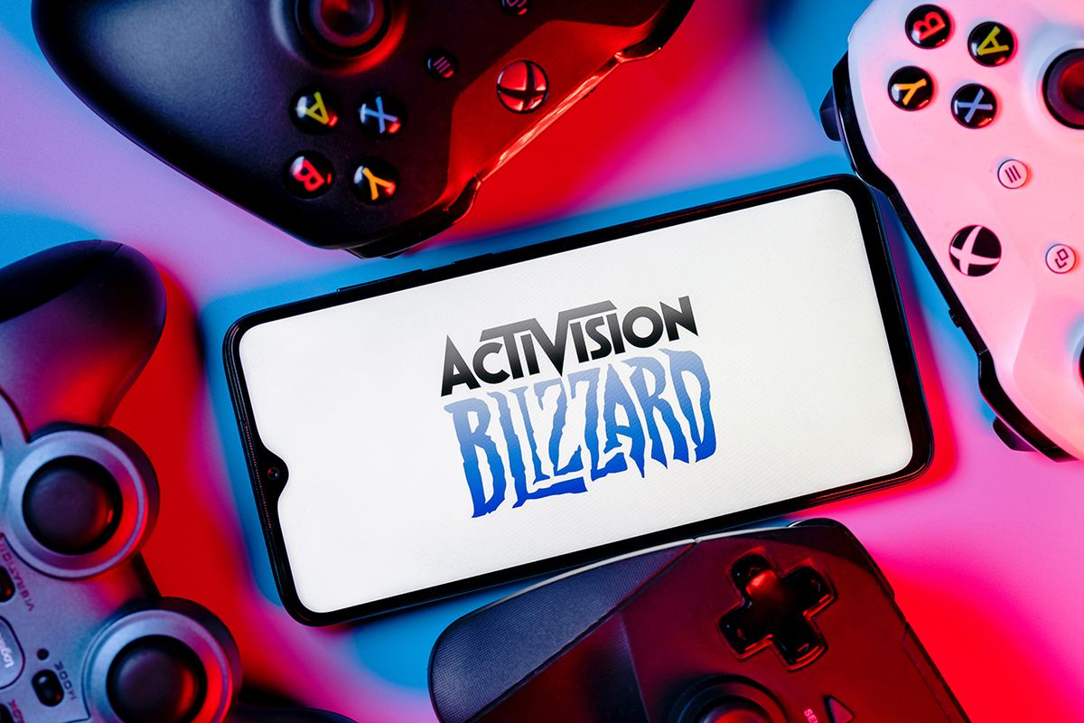 Kazan,,Russia,-,August,7,,2021:,Activision,Blizzard,,Inc.,Is
Kazan, Russia - August 7, 2021:  Activision Blizzard, Inc. is an American video game holding company. A smartphone with the Activision Blizzard logo on the screen surrounded by gamepads.