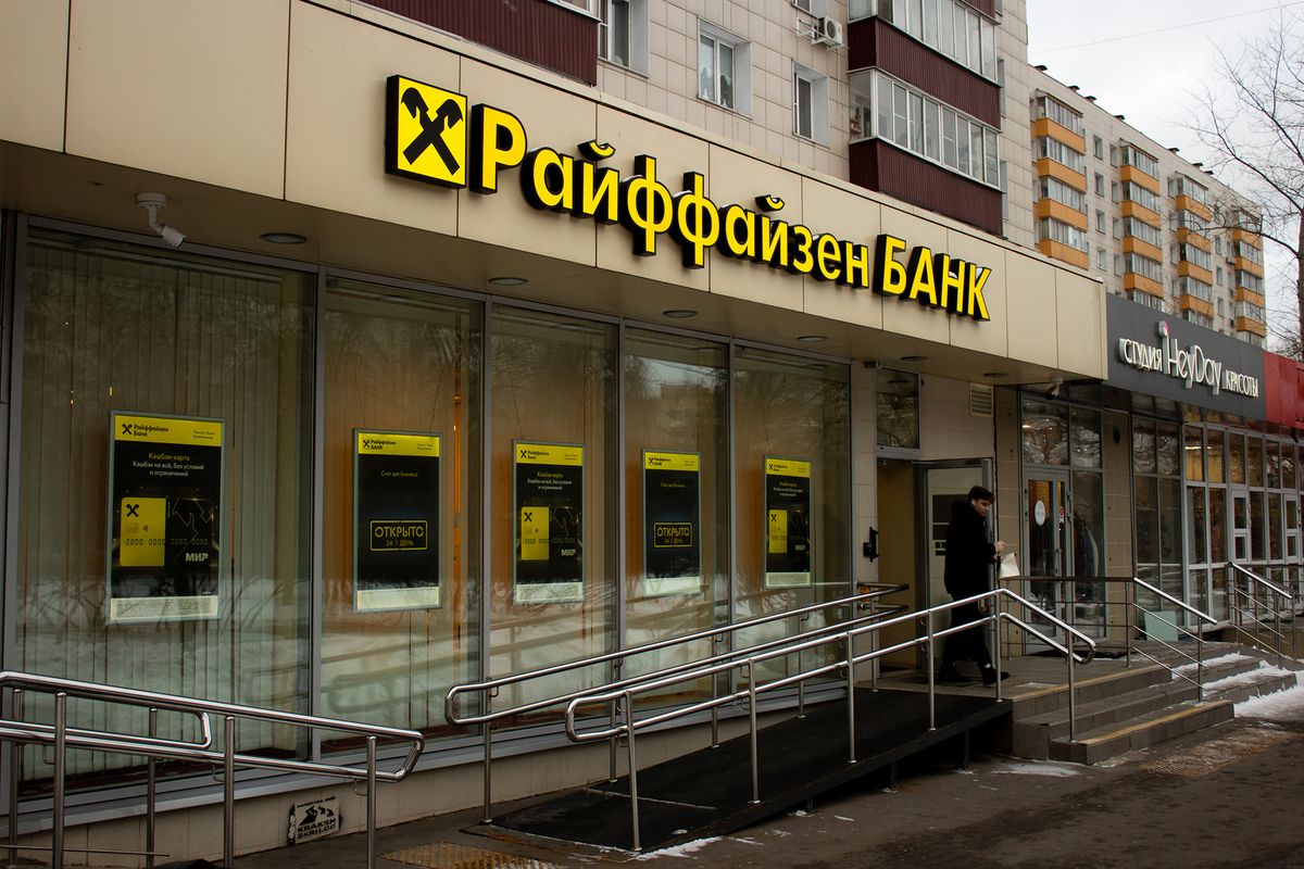 A man walks out of a Raiffeisen Bank office in Moscow