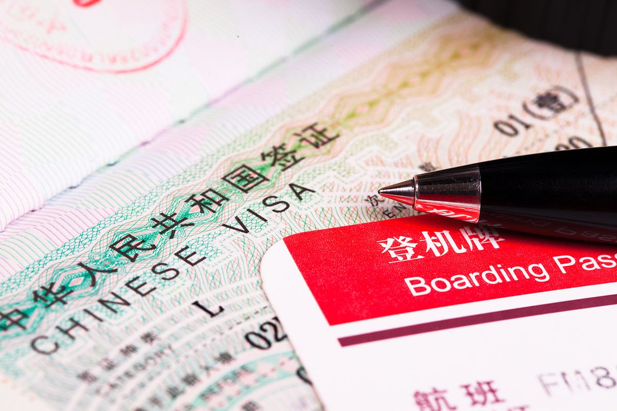 China,Visa,In,Passport,And,Boarding,Pass
China visa in passport and boarding pass