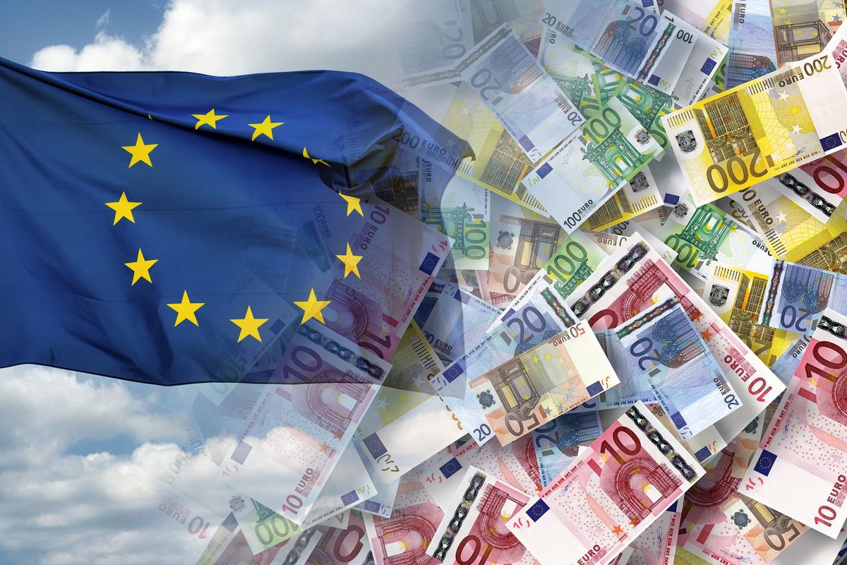European Union flag and cash euro banknotes