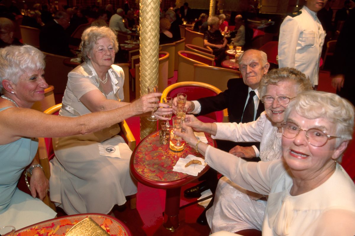 Italy, Holland America Line, seniors giving toast on cruise ship. (Photo by: Jeffrey Greenberg/Education Images/Universal Images Group via )