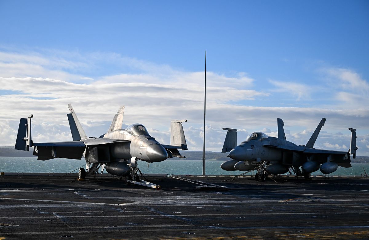 GOSPORT, ENGLAND - NOVEMBER 17: F-18 jet fighters are seen on the flight deck of USS Gerald R. Ford, on November 17, 2022 in Gosport, England. The USS Gerald R. Ford (CVN-78) is the lead ship of her class of United States Navy aircraft carriers. Commissioned in 2017, the carrier is powered by two nuclear reactors with a length of 1,092 feet and displacement of 100,000 long tons full load. With a crew of approximately 4,550, 75+ aircraft and state of the art weaponry, the first-in-class is the US Navy's most advanced aircraft carrier. USS Gerald Ford has been carrying out NATO exercises in the North Atlantic with French and Spanish ships. 