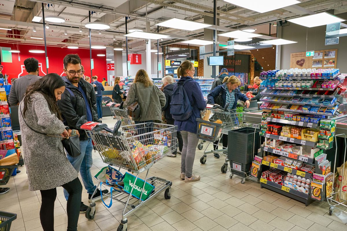 BERLIN, GERMANY - CIRCA SEPTEMBER, 2019: people in line at Kaufland in Berlin. Kaufland is a German hypermarket chain, part of the Schwarz Gruppe which also owns Lidl and Handelshof.