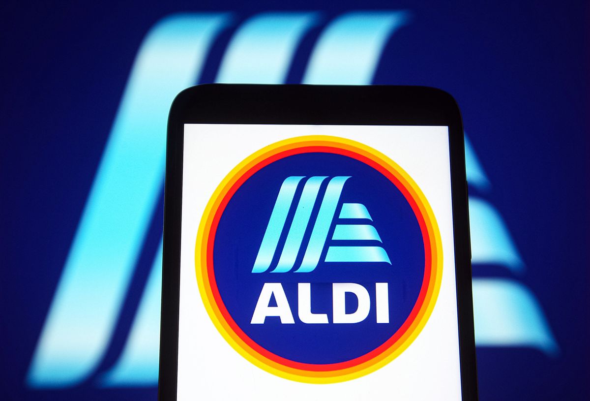 In this photo illustration an Aldi logo of a German UKRAINE - 2021/08/02: In this photo illustration an Aldi logo of a German supermarket company is seen on a smartphone screen. (Photo Illustration by Pavlo Gonchar/SOPA Images/LightRocket via Getty Images)