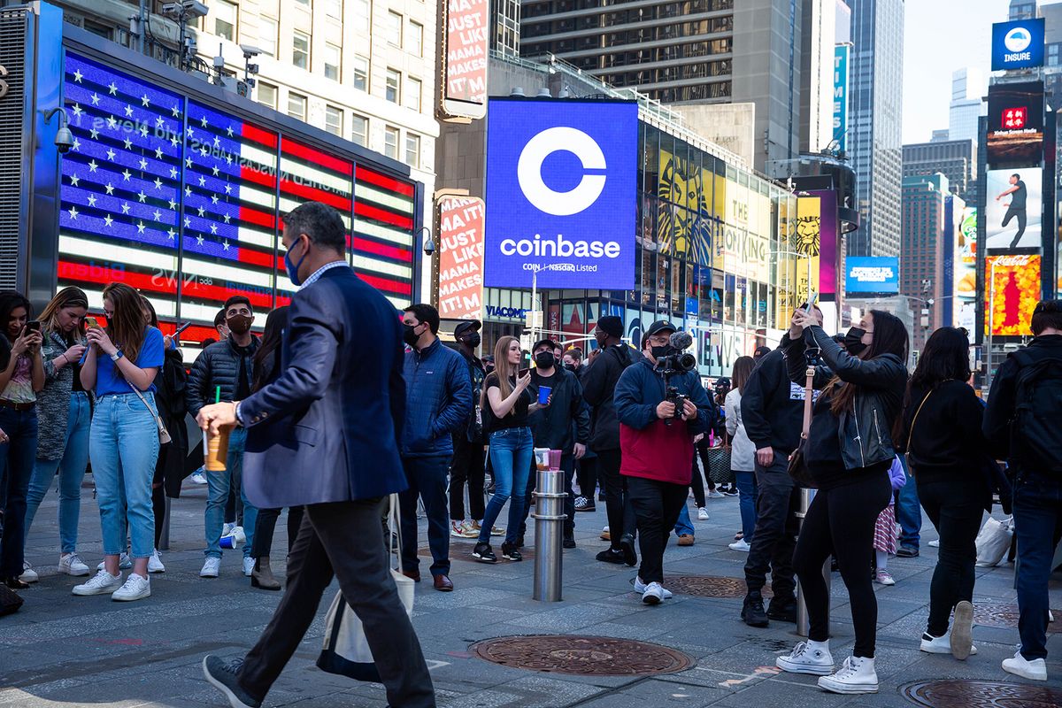 Coinbase Global Debuts Initial Public Offering At Nasdaq MarketSite
Monitors display Coinbase signage during the company's initial public offering (IPO) at the Nasdaq MarketSite in New York, U.S., on Wednesday, April 14, 2021. Coinbase Global Inc., the largest U.S. cryptocurrency exchange, is set to debut on Wednesday through a direct listing, an alternative to a traditional initial public offering that has only been deployed a handful of times. Photographer: Michael Nagle/Bloomberg via Getty Images