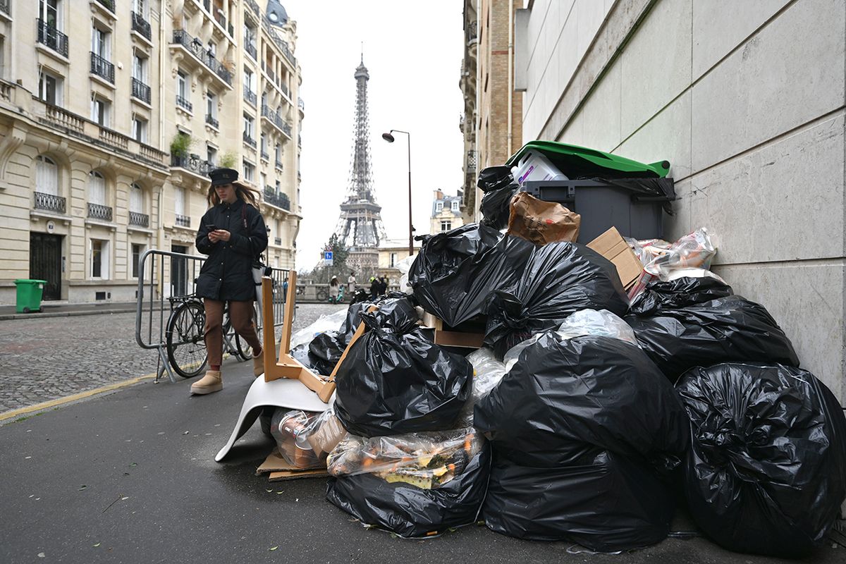 Garbage piles up in Paris as collectors go on strike PARIS, FRANCE - MARCH 13: Garbage cans overflowing with trash on the streets as collectors go on strike in Paris, France on March 13, 2023. Garbage collectors have joined the massive strikes throughout France against pension reform plans. (Photo by Mustafa Yalcin/Anadolu Agency via Getty Images)