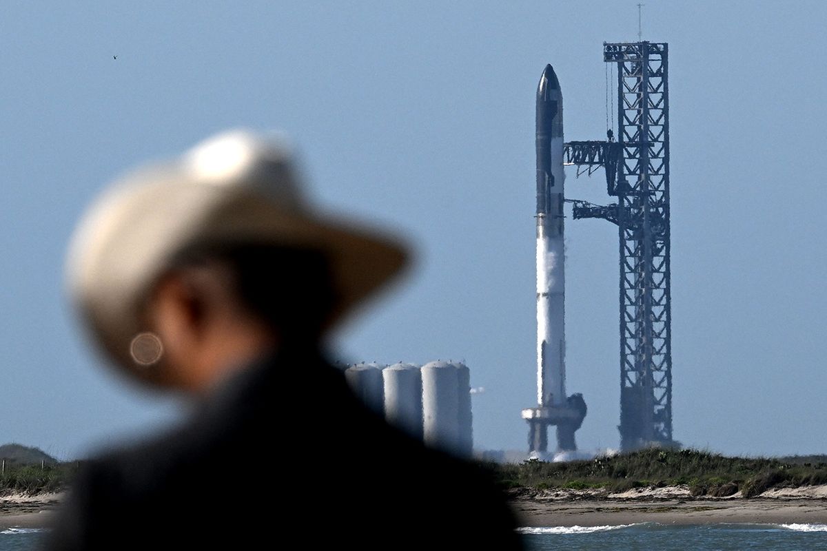 F The SpaceX Starship rocket stands on the launchpad from the SpaceX Starbase in Boca Chica as seen from South Padre Island, Texas, on April 17, 2023. - SpaceX on Monday postponed the first test flight of Starship, the most powerful rocket ever built. Liftoff of the giant rocket was called off just minutes ahead of the scheduled launch time because of a pressurization issue, SpaceX officials said. (Photo by Patrick T. Fallon / AFP)