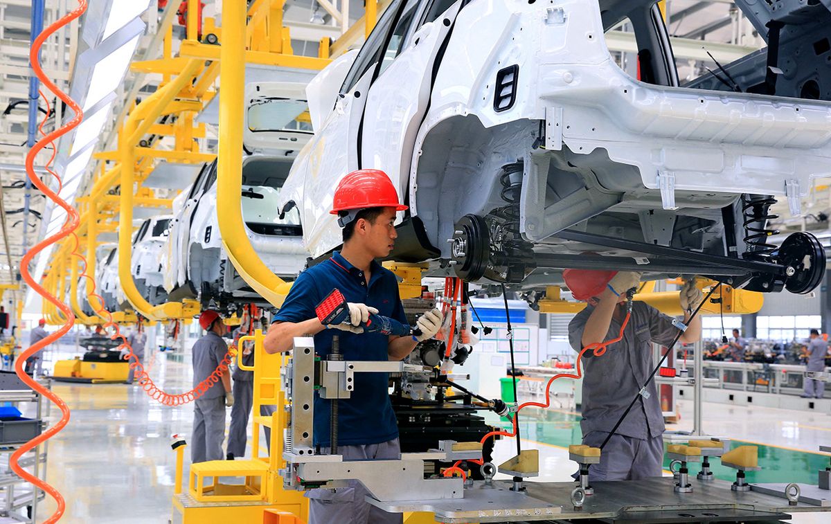 Hozon kicks off mass production with first all-electric Neta N01
Chinese workers assemble Neta N01 electric vehicles on the assembly line at the auto plant of Hozon New Energy Automobile in Tongxiang city, Jiaxing city, east China's Zhejiang province, 31 July 2018.Chinese startup Hozon New Energy Automobile rolled out its first electric vehicle ready for mass production. Hozon revealed its first sport utility vehicle Neta N01 at a factory in Tongxiang, the Zhejiang-based electric car firm said in a statement. The sales are expected to start by the third quarter this year. Hozon's goal is to sell more than 100,000 cars in total by 2020 and strive to rank among the top ten new energy vehicle manufacturers and among the top three new auto firms in China, company President Zhang Yong told Yicai Global. (Photo by Zhejiang Daily / Imaginechina / Imaginechina via AFP)