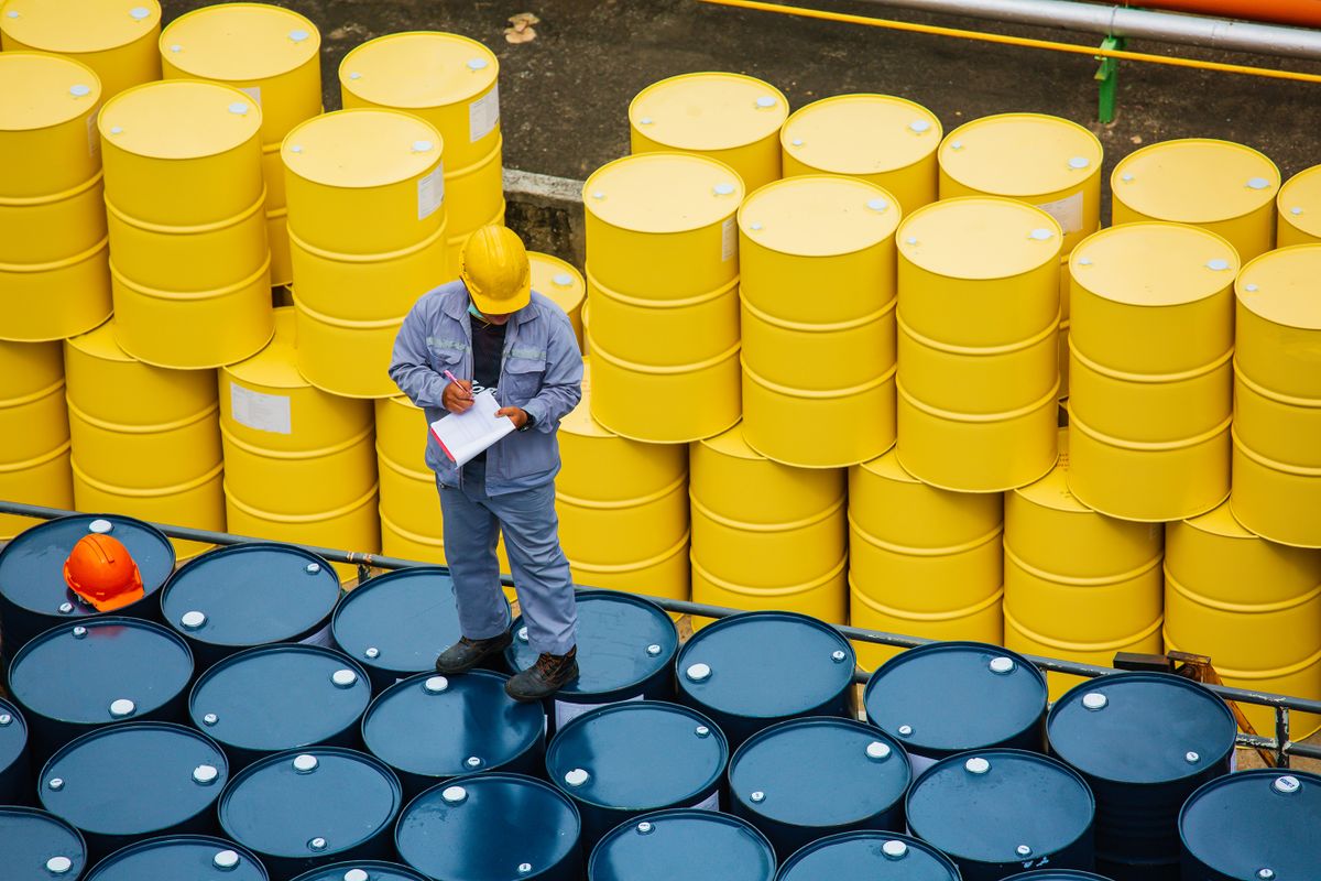 Male,Worker,Inspection,Record,Drum,Oil,Stock,Barrels,Yellow,Vertical