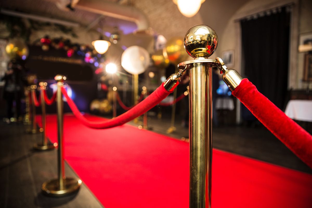 Red,Carpet,Between,Rope,Barriers,In,The,Success,Party Red carpet between rope barriers in the success party
