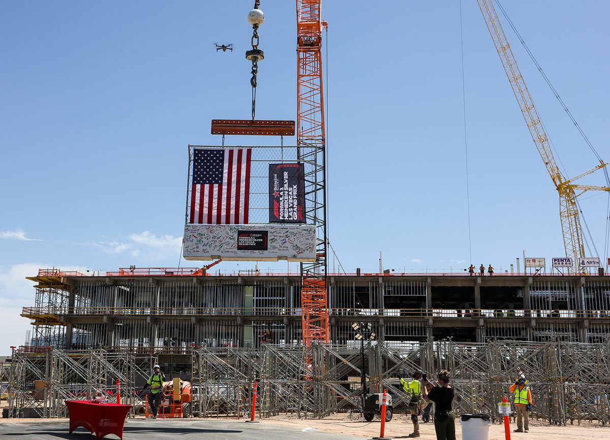 Formula 1 Las Vegas Grand Prix Paddock Building Topping Out Ceremony
LAS VEGAS, NEVADA - APRIL 13: Construction workers lift a track safety barrier signed by executives to the top of the Las Vegas Grand Prix paddock building during a topping out event on April 13, 2023 in Las Vegas, Nevada. The Formula 1 Las Vegas Grand Prix inaugural race weekend is scheduled to take place November 16-18, 2023, with the race itself to begin on the night of November 18. (Photo by Ethan Miller/Getty Images)