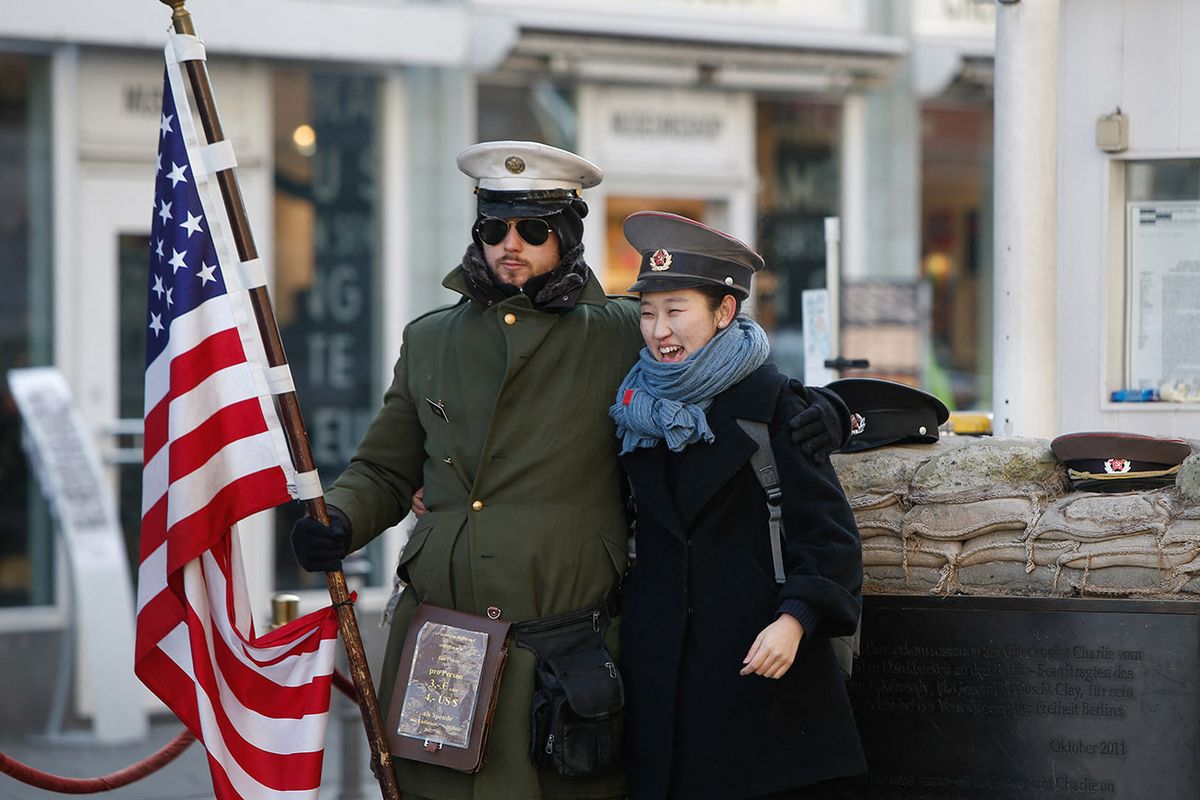 Daily Life In Berlin
Tourists are seen having their picture taken on a cold morning  on 13 February, 2017 at checkpoint Charlie where formerly the border between the Soviet occupied East and free Western part of the city existed. (Photo by Jaap Arriens/NurPhoto) (Photo by Jaap Arriens / NurPhoto / NurPhoto via AFP)